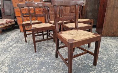 A SET OF SIX EARLY 19th C. OAK DINING CHAIRS WITH DROP IN RUSH SEATS