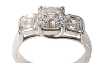 A THREE STONE DIAMOND RING with GIA Certificate, the certifi...