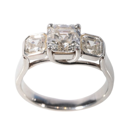 A THREE STONE DIAMOND RING with GIA Certificate, the certifi...