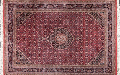 A Tabriz fish design hand knotted wool rug, 6’7” x 9’9”