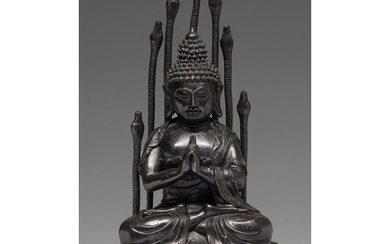 A Tibetan bronze figure of Buddha Nagaraja, 18th c, seated i...
