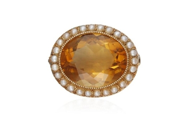 A VICTORIAN CITRINE AND SEED PEARL BROOCH The oval-shaped citrine...