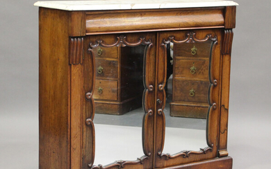 A Victorian rosewood and white marble-topped side cabinet, fitted with a pair of mirrored doors, on