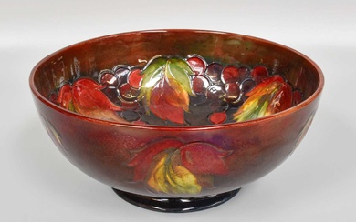 A William Moorcroft Flambé "Leaves and Fruit" Pattern Bowl, produced...