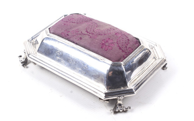 A William and Mary silver canted-rectangular table pin cushion.