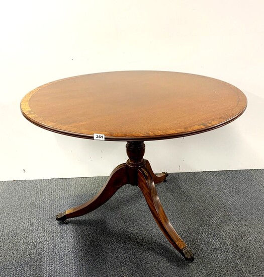 A brass inlaid regency style mahogany veneered tea table, Dia. 106cm.