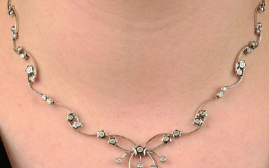A brilliant-cut diamond star motif necklace.