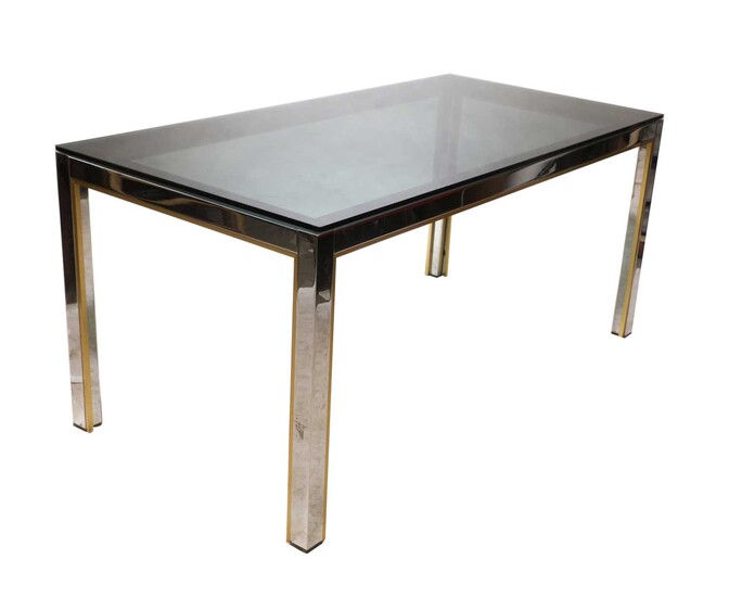A chrome and brass dining table