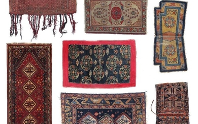 A collection of seven Oriental rugs/weavings. An Ersari torba, Tukmenia. C. 1930....
