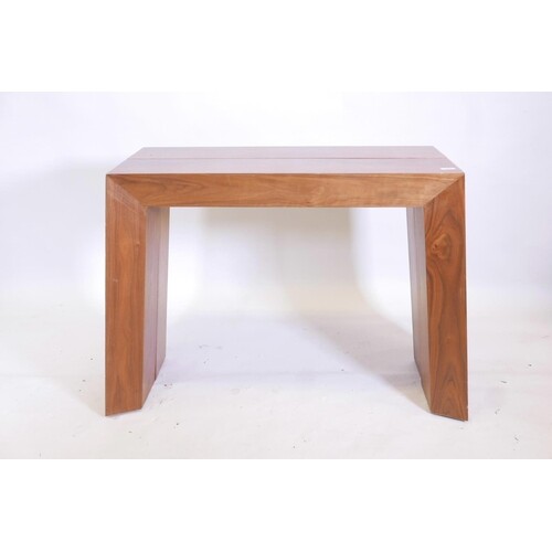 A contemporary designer mahogany pull out console table with...