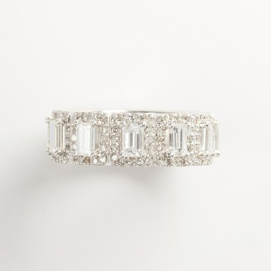 A diamond and eighteen karat white gold band ring