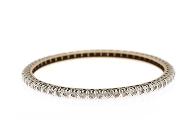 A diamond bangle set with numerous brilliant-cut diamonds, mounted in 18k gold and silver. Diam. 6.5 cm. Weight app. 18 g.