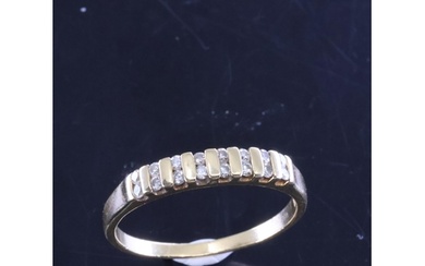 A diamond set half eternity ring in 18kt gold, finger size N...