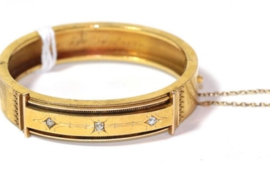 A diamond set hinged bangle, unmarked, measures 5.6cm by 4.7cm...