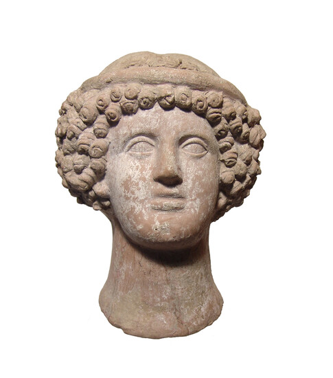 A fabulous Etruscan terracotta head of a young woman
