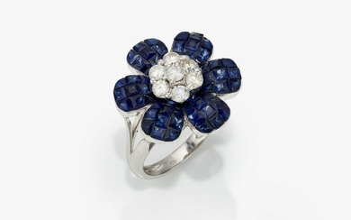 A floral cocktail ring decorated with sapphires and
