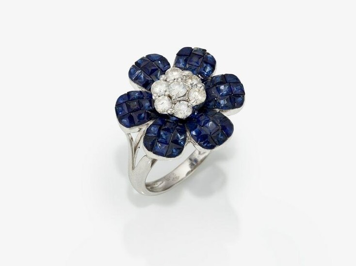 A floral cocktail ring decorated with sapphires and