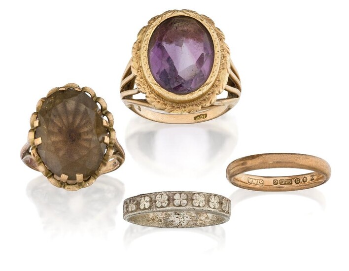 A group of four rings comprising: an oval amethyst ring, collet-set in chased mount to openwork shoulders, hoop stamped 750, approx. ring size P; a claw-set smoky quartz ring, hoop stamped 9ct, approx. size L; a 9ct plain gold wedding band, approx...