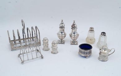 A group of silver, comprising: a four division silver toast rack, Sheffield, 1902, Mappin & Webb, 8.8cm wide; a six division toast rack, Sheffield, 1926, James Dixon & Sons Ltd; a pair of Victorian peppers with gadrooned lower bodies on square...