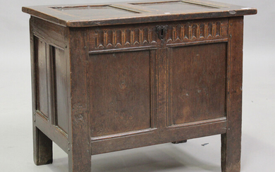 A late 17th century oak panelled coffer with stop fluted frieze above double panel front, on stile s
