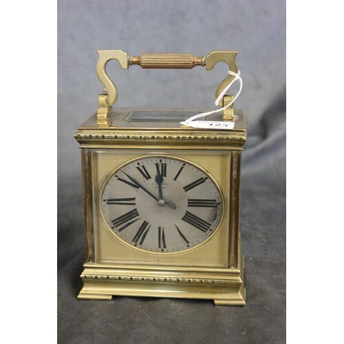 A late 19th century gilt brass carriage clock, of squat form...