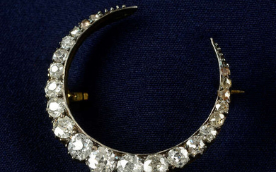 A late Victorian silver and gold, old and rose-cut diamond crescent brooch.