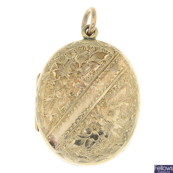 A locket, with engraved clover detail.
