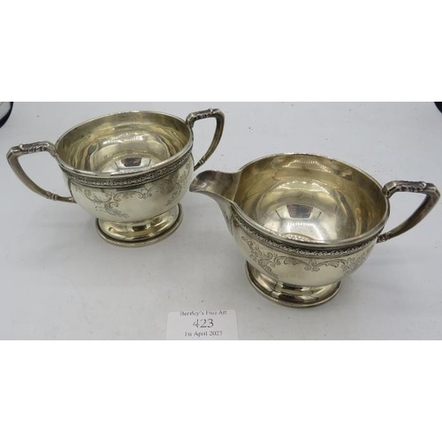 A matching pair of silver pedestal cream jug & sugar bowl, w...