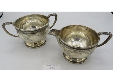 A matching pair of silver pedestal cream jug & sugar bowl, w...