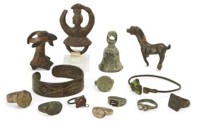 A miscellaneous group of bronze jewellery and artefacts 1st Millennium B.C. – 1st Millennium A.D. and Later Including eight rings with disc, oval or square bezel, others with the remains of intaglios; a bronze penannular bracelet, the hoop formed...