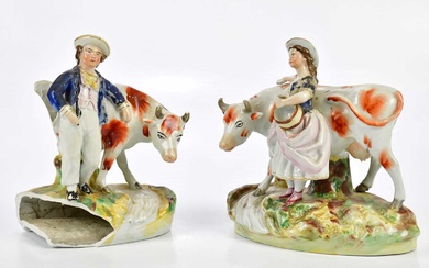 A pair of 19th century Staffordshire figures, representing a boy...