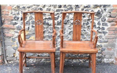 A pair of 20th century Chinese Ming style hardwood armchairs...