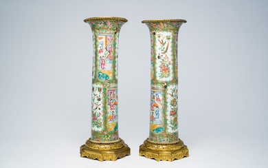 A pair of Chinese Canton famille rose gilt bronze mounted sleeve vases with palace scenes,...