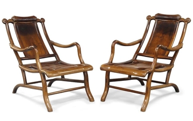 A pair of Chinese hongmu reclining 'moongazing' chairs, late Qing dynasty, the shaped scroll-cared top rail above solid back splat and seat with swept arms and front supports 清晚期 紅木躺椅一對