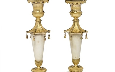 A pair of French gilt bronze and white marble candlesticks in the Chinese style. Late 18th century. H. 25 cm. (2)