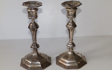 A pair of Queen Anne style silver candlesticks, of...