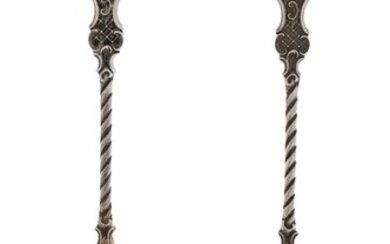 A pair of Victorian silver serving spoons, London, 1895, Goldsmiths & Silversmiths Co., designed with scalloped gilt bowls to twisted stems and mask terminals, 21.2cm long, total weight approx. 5.2oz (pr)