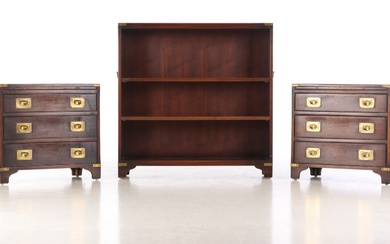 A pair of chests of drawers and a bookcase of mahogany in Military style, 20th century (3)