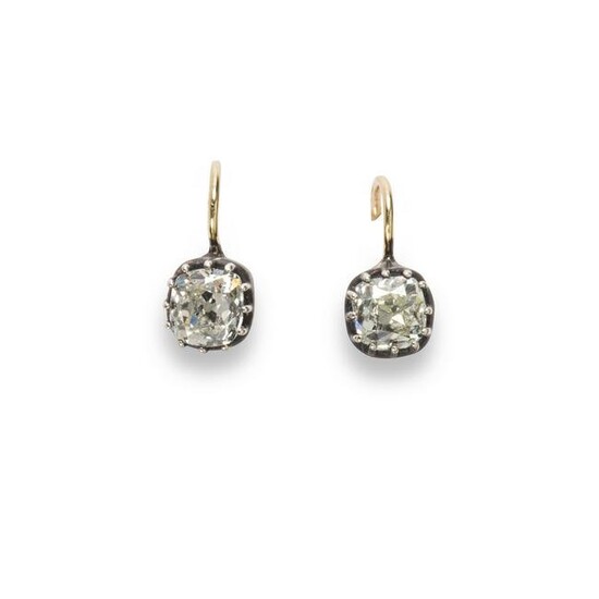 A pair of diamond and fourteen karat gold drop earrings