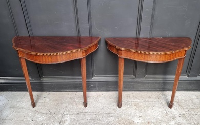 A pair of early 20th century mahogany and inlaid console tab...