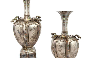 A pair of elegant Japanese vases made of silver and...