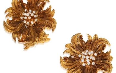 A pair of fourteen karat gold and diamond brooches...