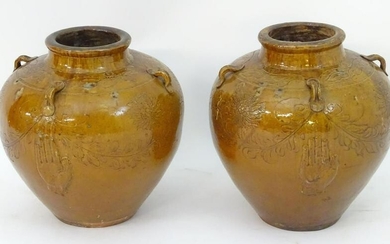 A pair of large Chinese earthenware salt glaze vases