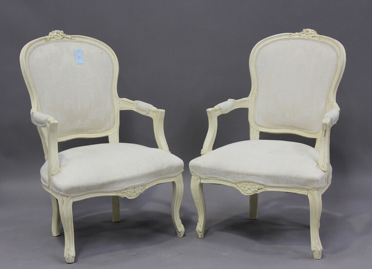 A pair of late 20th century French cream painted showframe fauteuil armchairs, height 91cm, width 63