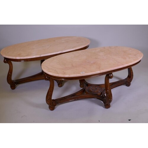 A pair of marble top occasional tables, raised on a carved b...