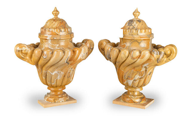 A pair of simulated Siena marble plaster urns and covers