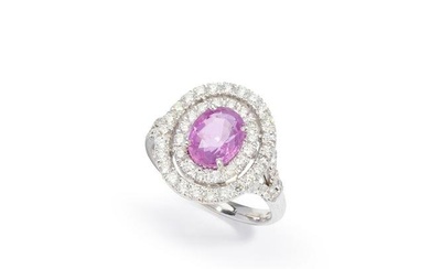 A pink sapphire and diamond target cluster ring