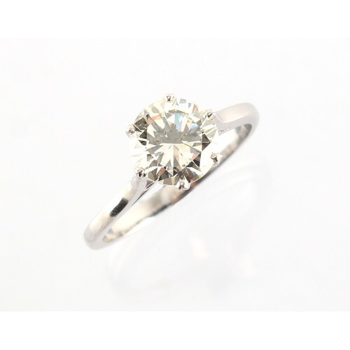 A platinum or white gold diamond single stone ring, the roun...