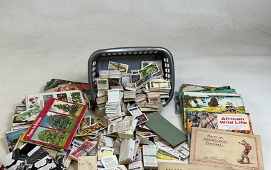 A quantity of cigarette cards and albums and postcardsCondition Report...