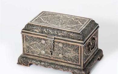 A rectangular silver filligree casket and hinged cover...